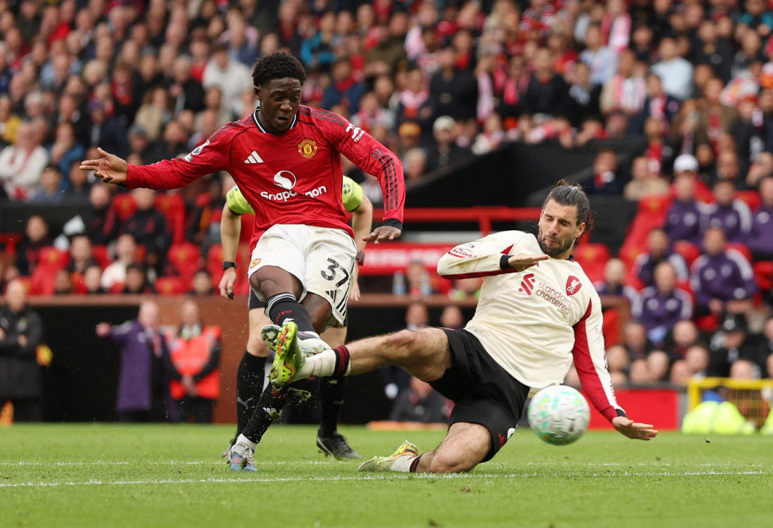 Manchester United’s Kobbie Mainoo scores their third goal against Liverpool at Old Trafford. (Reuters)