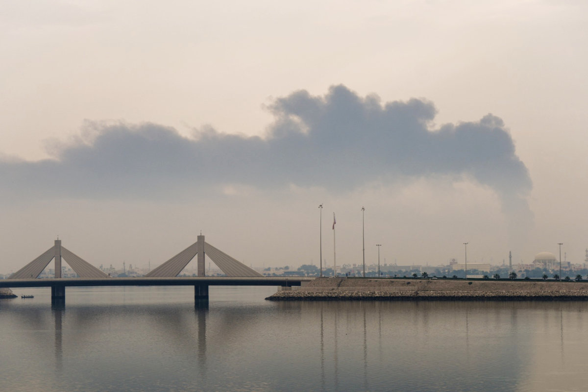 A plume of smoke rises after a reported Iranian strike on fuel tanks in Muharraq, Bahrain, on March 12, 2026. During its war with the US and Israel that began on Feb. 28, Iran attacked other targets across in Bahrain, Kuwait, Qatar, Saudi Arabia and the UAE. (AFP file photo)