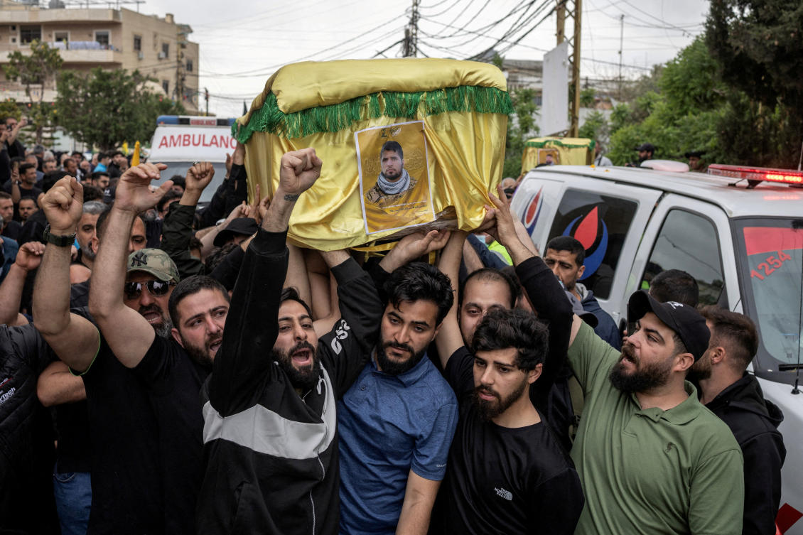 Mourners carry coffins during the funeral of four Hezbollah fighters and two civilians in the village of Maaroub, southern Lebanon on April 26, 2026. (Reuters)