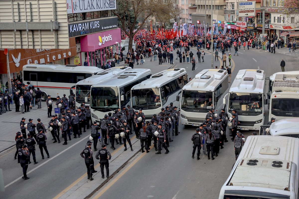 Turkish riot police block a street as teachers and members of education unions march during a protest against school shootings, in Ankara on April 16, 2026. (AFP)