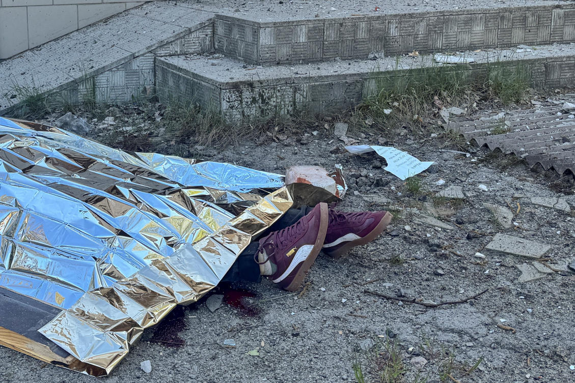The body of a killed resident lays on the ground at the site of a Russian missile strike in the town of Merefa, amid Russia's attack on Ukraine, in the Kharkiv region, Ukraine May 4, 2026. (REUTERS)