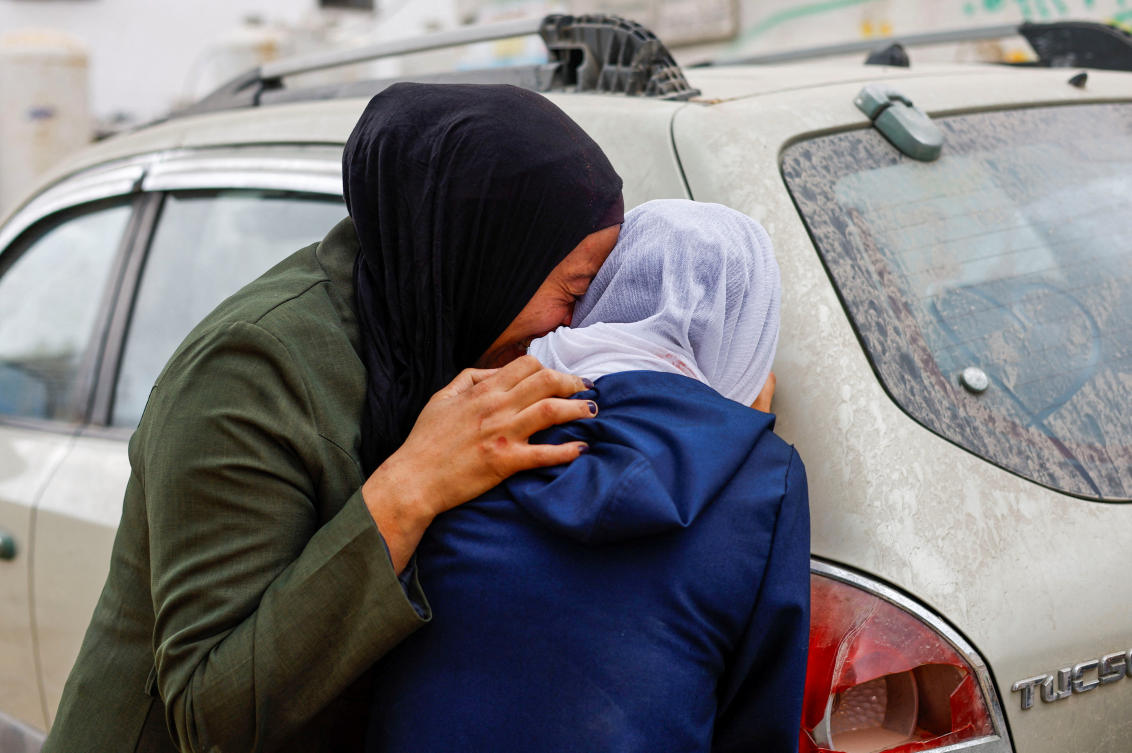 Mourners attend the funeral of Palestinian Mohammed Al-Ghandour, who was killed in an Israeli strike overnight, according to medics at Al-Shifa Hospital in Gaza City on Tuesday. (Reuters)