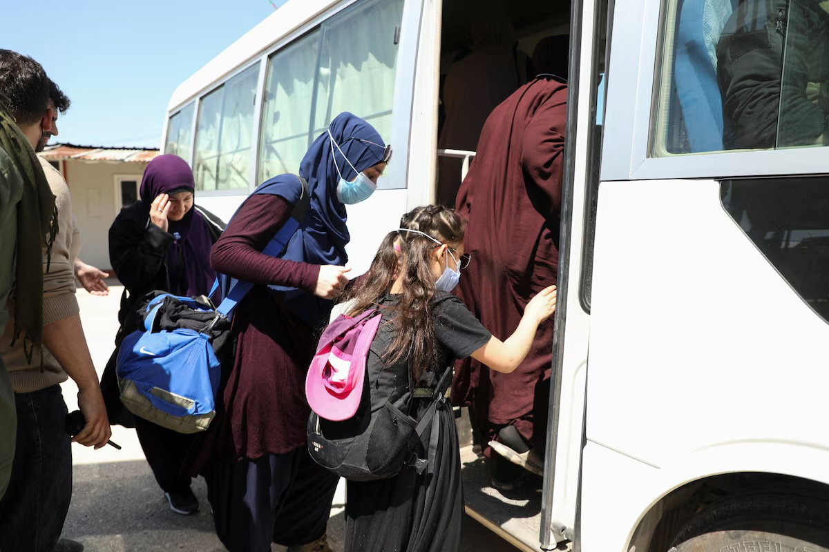 Members of Australian families believed to be linked to the Daesh militants leave Roj camp near Derik, Syria April 24, 2026. (Reuters)