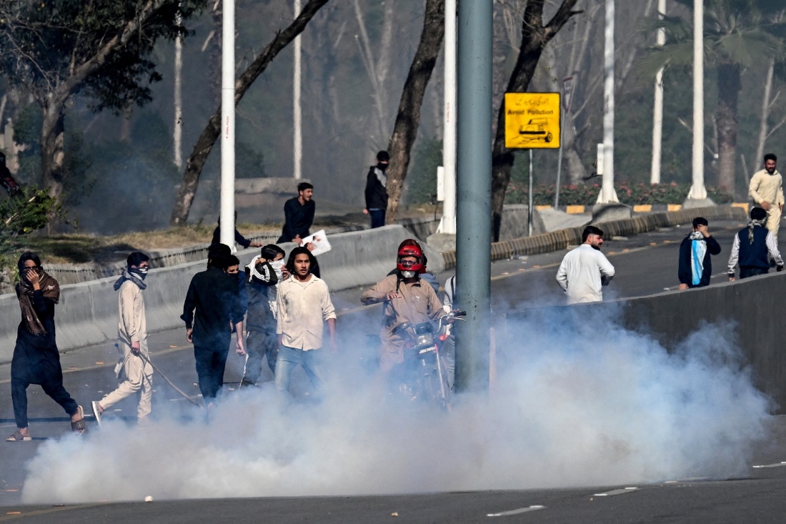 Shiite Muslims disperse after riot police fired tear gas shells during their attempt to storm the US embassy in Islamabad on March 1, 2026 following the death of Iran's supreme leader Ayatollah Ali Khamenei amid US-Israel strikes. (AFP)