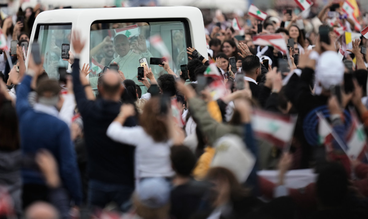 Pope Leo XIV waves to the crowd as he arrives to celebrate a Holy Mass at Beirut waterfront on Dec. 2, 2025. (AP)