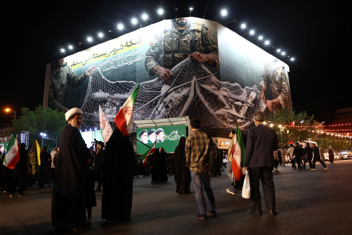 Above, a billboard with a graphic design about the Strait of Hormuz on a building in Tehran on May 6, 2026. (WANA via Reuters)