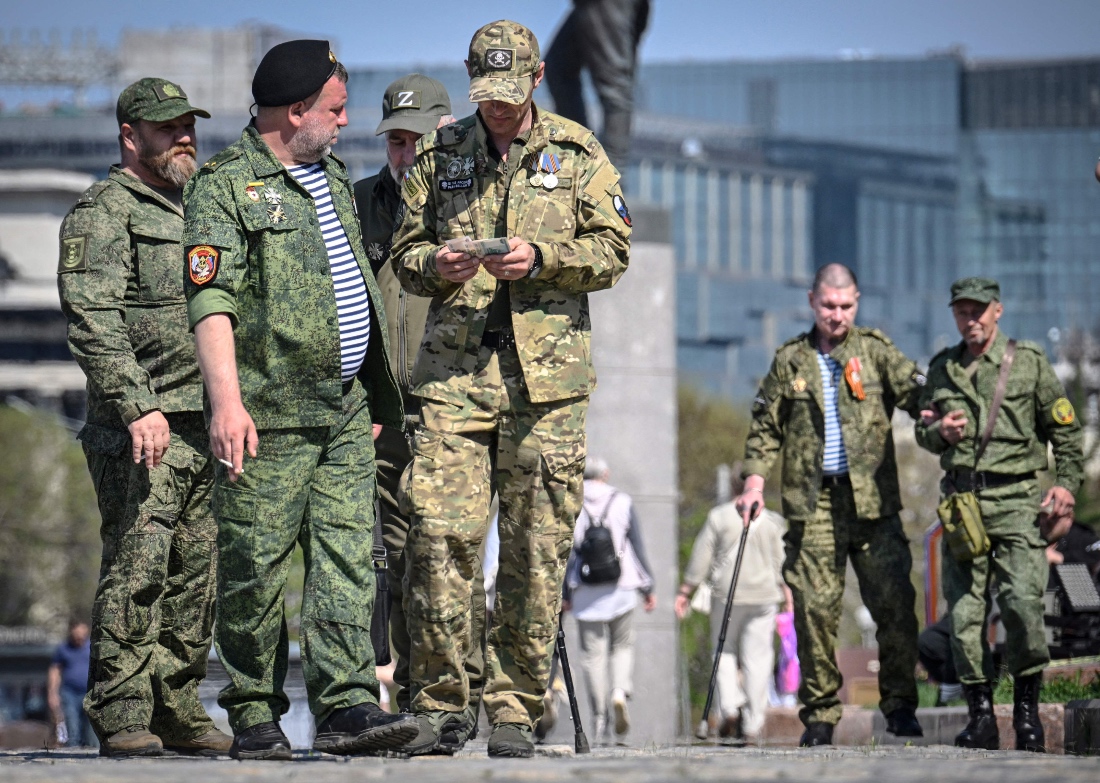 Russian veterans of the Russian-Ukrainian conflict walk outside the Museum of the Great Patriotic War at Poklonnaya Hill in western Moscow, Russia. (AFP)