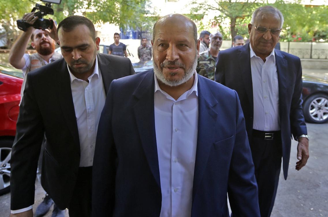Hamas's chief representative in Lebanon Osama Hamdan (L), Hamas arab relations chief Khalil al-Hayya (C), secretary general of the Popular Front for the Liberation of Palestine-General Command, Talal Naji, arrive for a press conference during a visit to the Syrian capital Damascus on October 19, 2022. (FILE/AFP)