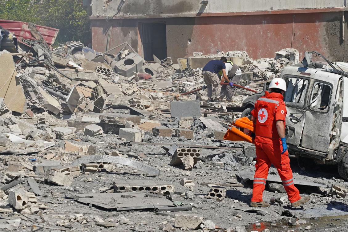 First responders arrive at the site of an Israeli airstrike that targeted the southern Lebanese village of Habbouch on May 7, 2026. (AFP)