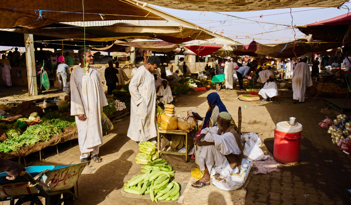 Customers buy vegetables at a market in Omdurman, on the outskirts of Khartoum, Sudan, Sunday, April 26, 2026. (AP)