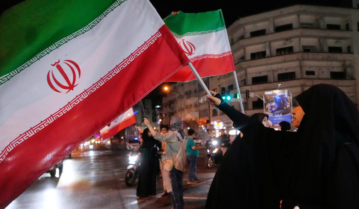 Women hold Iranian flags for a pro-government campaign in downtown Tehran, Iran, Friday, May 8, 2026. (AP)