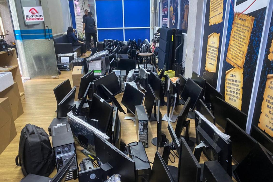 A handout picture taken on May 6, 2026, and released by the Batam Immigration Office shows computers seized during a raid by Indonesian immigration authorities and police that detained 210 foreign nationals over an alleged online investment scam operation at an apartment complex in Batam in Riau Islands Province. (FILE/AFP)