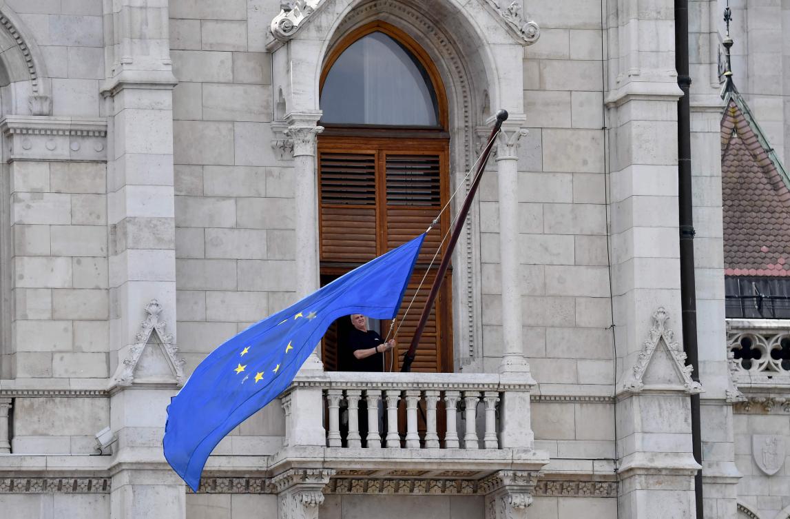 The EU flag is placed at the building of the Hungarian Parliament, after the newly appointed parliament speaker ordered the flag be hung back on the building in Budapest on May 9, 2026. (AFP)