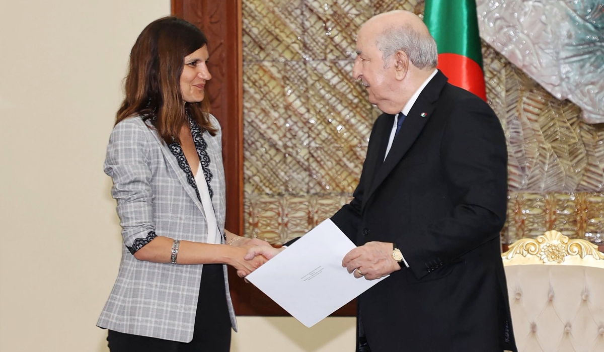 France's junior Minister for Veterans affairs Alice Rufo (L) delivering a letter from the French president to Algeria's President Abdelmadjid Tebboune in Algiers. (AFP)