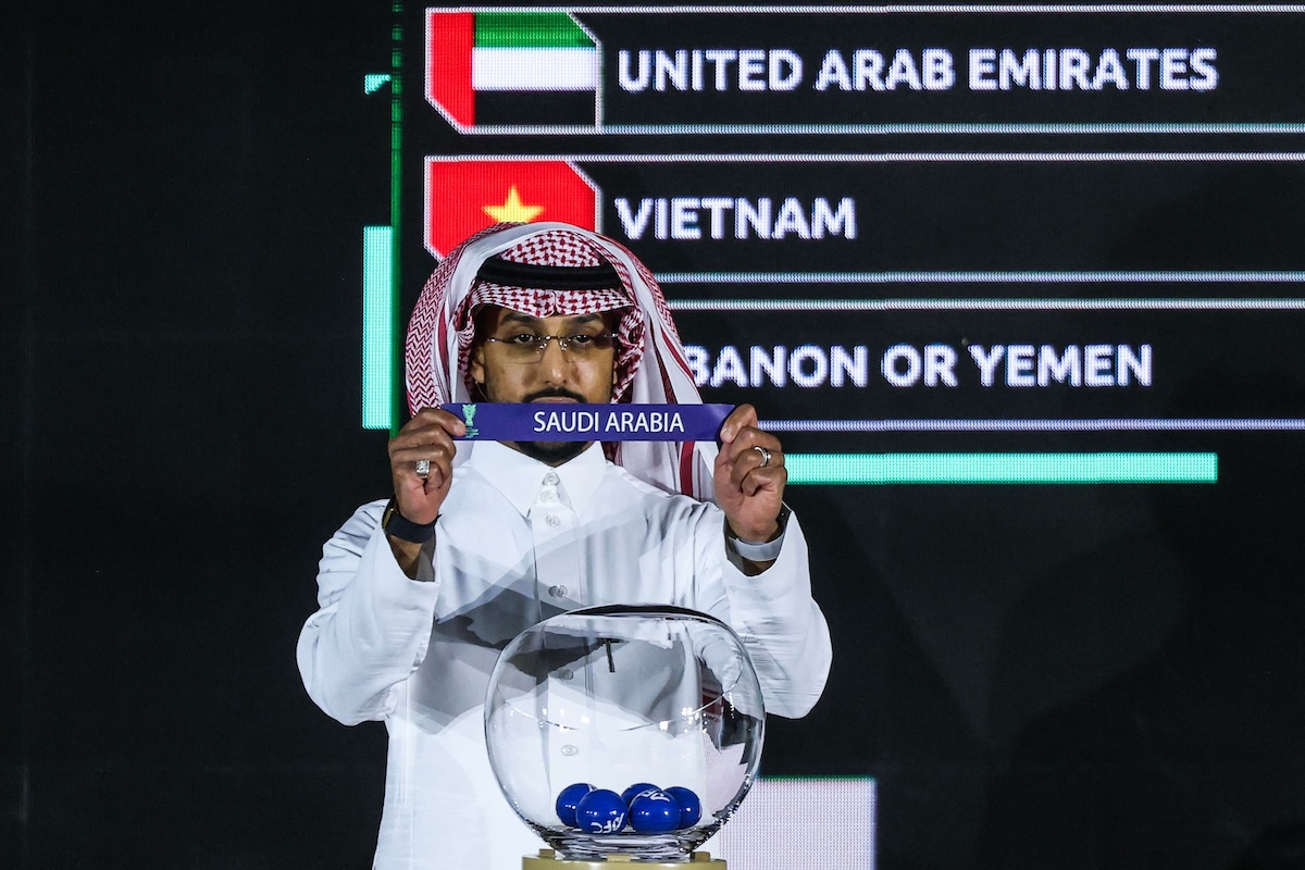 AFC Asian Player of the Year and Saudi Arabia captain Salem Al-Dawsari shows the paper slip of Saudi Arabia during the final draw of the 2027 AFC Asian Cup in Diriyah on May 9, 2026. (AFP)