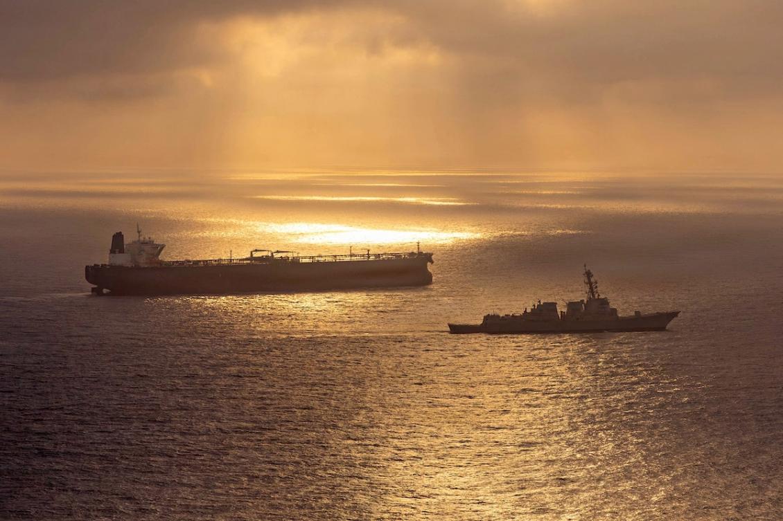 This US Navy handout photo released on May 8, 2026 by US Central Command Public Affairs, shows the Arleigh Burke-class guided-missile destroyer USS Rafael Peralta (DDG 115) implementing a maritime blockade against the Iran-flagged crude oil tanker vessel Herby while the latter was attempting to sail toward an Iranian port, on April 24, 2026. (FILE/AFP)