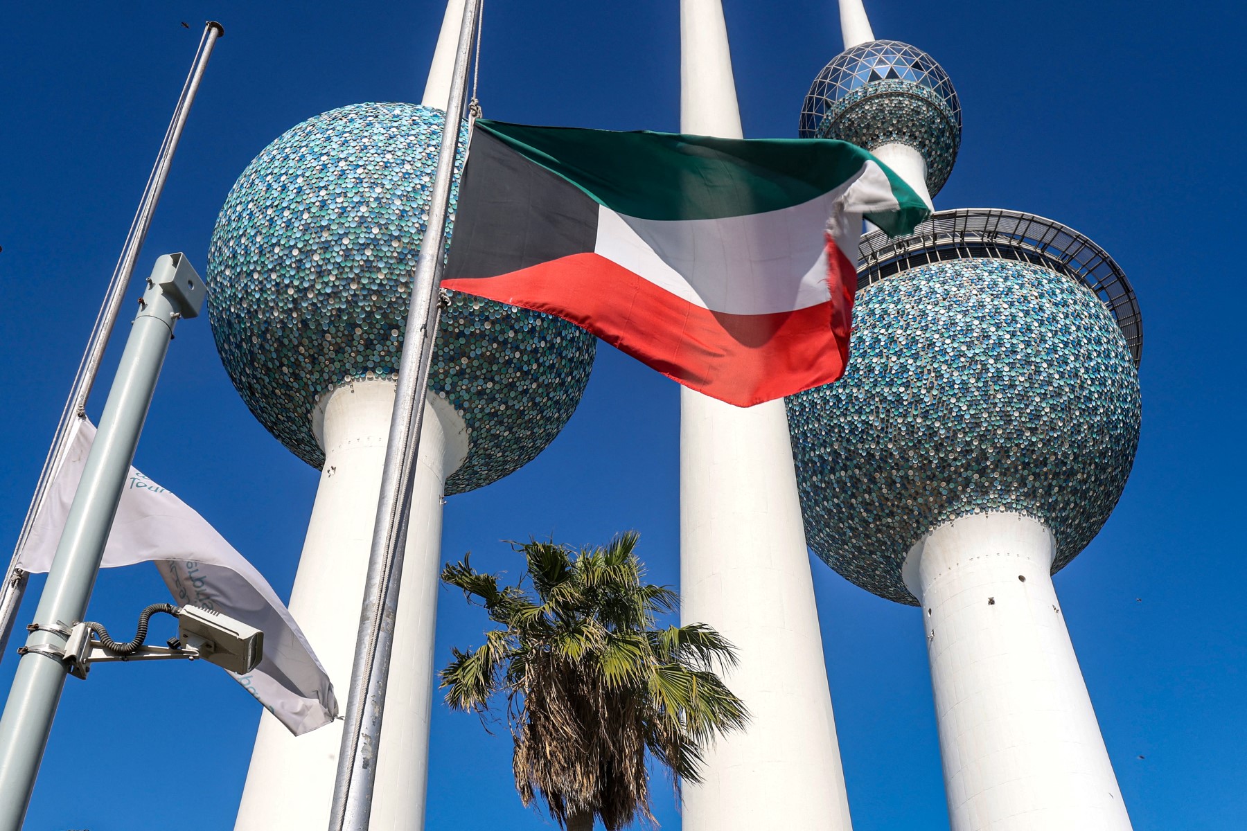 Kuwait's national flags outside the landmark Kuwait Towers in Kuwait City on December 16, 2023. (AFP)