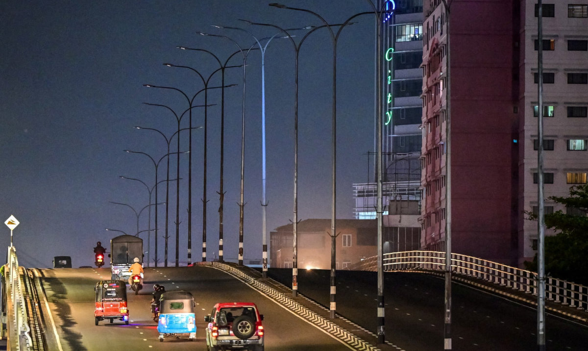 Vehicles move past switched-off street lights along a flyover in Colombo on April 2, 2026 as authorities order measures to save electricity amid an energy shortage across the country. (AFP)