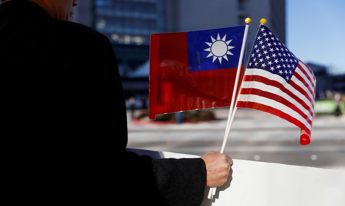 A man holds flags of Taiwan and the United States during Taiwanese President Tsai Ing-wen stop-over after her visit to Latin America in Burlingame, California, US. (Reuters/File)