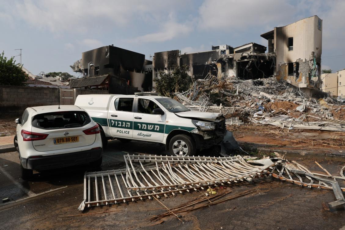 Cars are parked in front of an Israeli police station that was damaged during battles to dislodge Hamas militants who were stationed inside on Oct. 8, 2023. (AFP file photo)