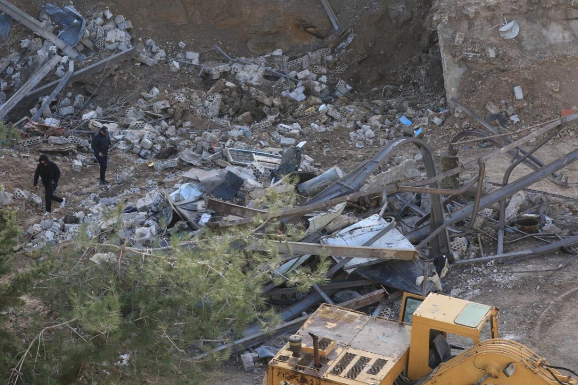 Residents inspect the rubble of a building in the southern Lebanese village of Kfar Dounine on Jan. 25, 2026, after being hit by an Israeli strike. (AFP file photo)