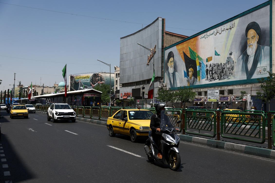 A mural depicting the late leader of the Islamic Revolution, Ayatollah Ruhollah Khomeini, and the late Iran's Supreme Leader Ayatollah Ali Khamenei, in Tehran, on Tuesday. (West Asia News Agency via Reuters)