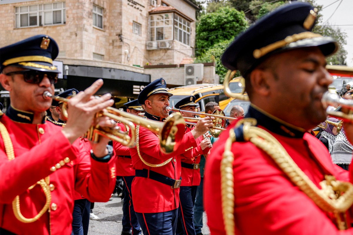 A marching band performs during a demonstration commemorating the 78th anniversary of the Nakba in the city of Ramallah in the occupied West Bank, May 12, 2026. (AFP)