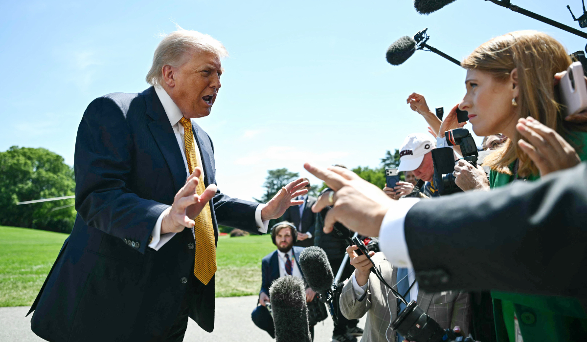 US President Donald Trump speaks to the press before walking to board Marine One as he departs from the South Lawn of the White House in Washington, DC, on May 12, 2026. (AFP)