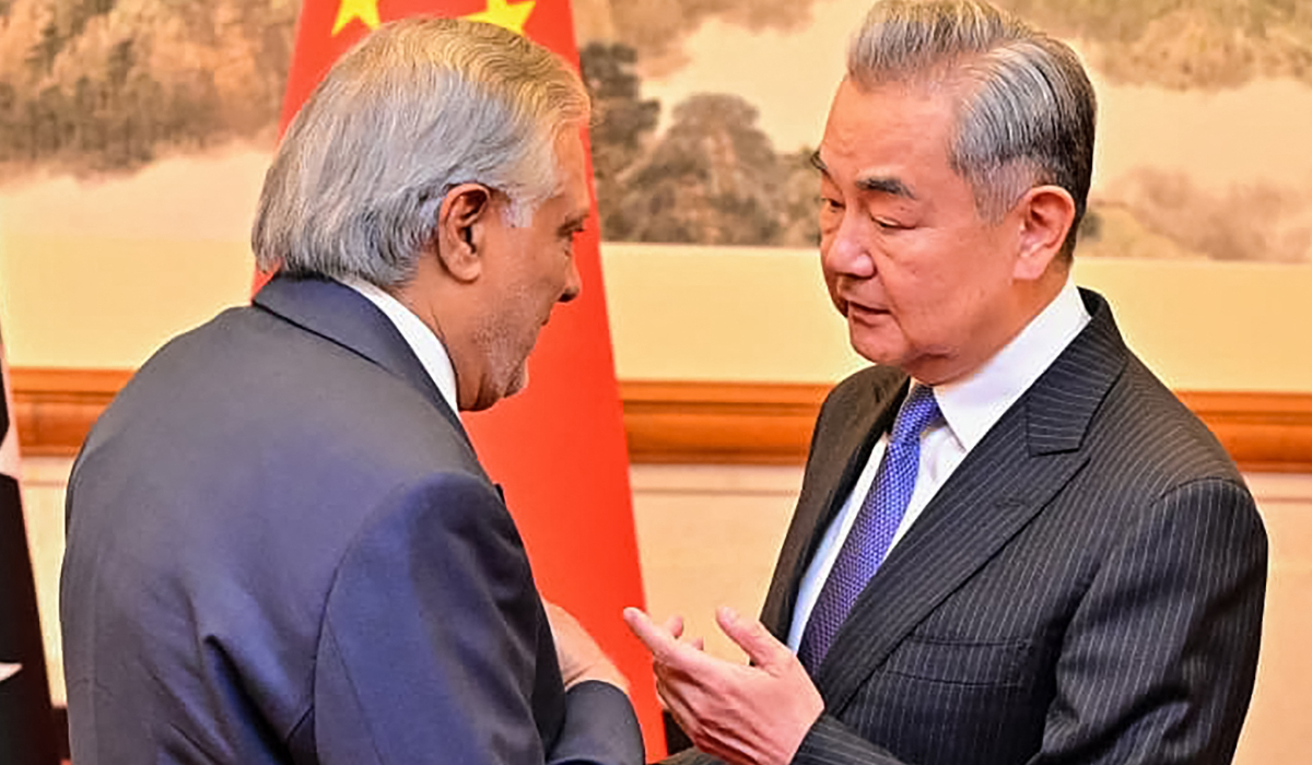 China's Foreign Minister Wang Yi (R) speaking with his Pakistani counterpart Ishaq Dar in Beijing. (AFP file photo)