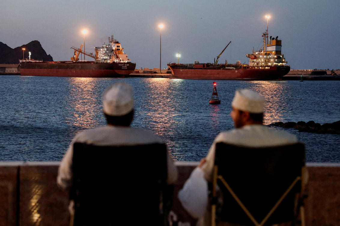 Above, the Galaxy Globe bulk carrier and the Luojiashan tanker sit anchored in Muscat on March 9, 2026. (Reuters)