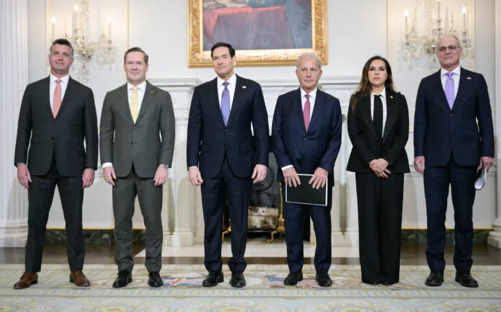 Delegates stand together before a meeting at the State Department in Washington, DC, on April 14, 2026. (AFP)