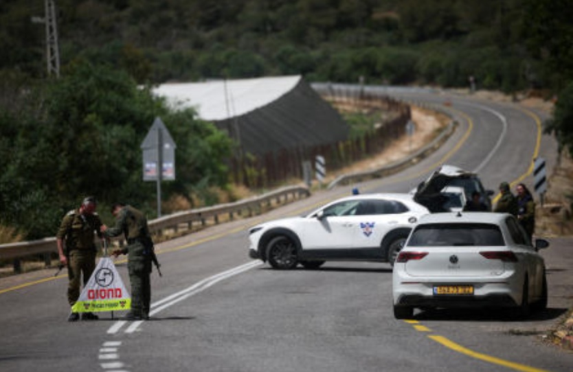 Soldiers set up a roadblock on the road leading to the tourist site of Rosh HaNikra in northern Israel, following a drone strike from Lebanon that injured three Israeli civilians according to the Israeli military, May 14, 2026. (Reuters)