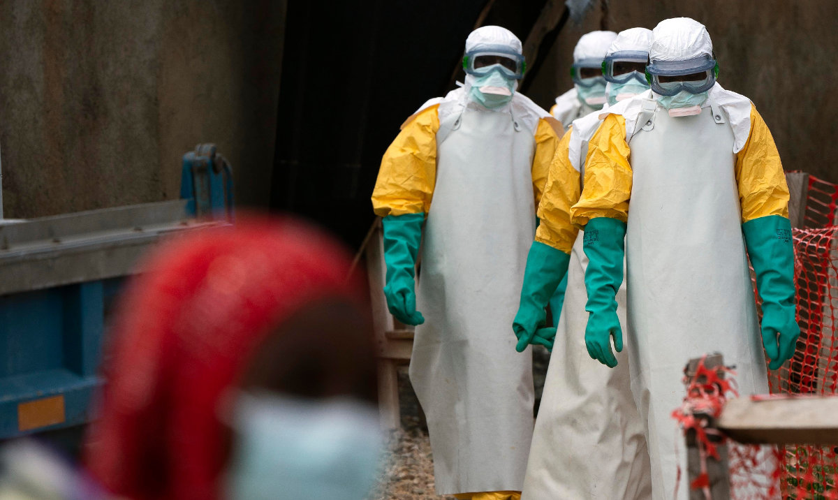 Health workers dressed in protective gear begin their shift at an Ebola treatment center in Beni, Congo in 2019. (AP)