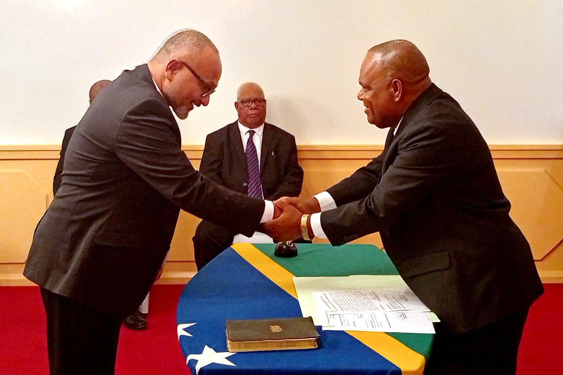 A photo taken and released by the Solomon Islands Government on May 15, 2026, shows Solomon Islands' new prime minister Matthew Wale being sworn in by Governor-General David Kapu at Government House in Solomon Islands.