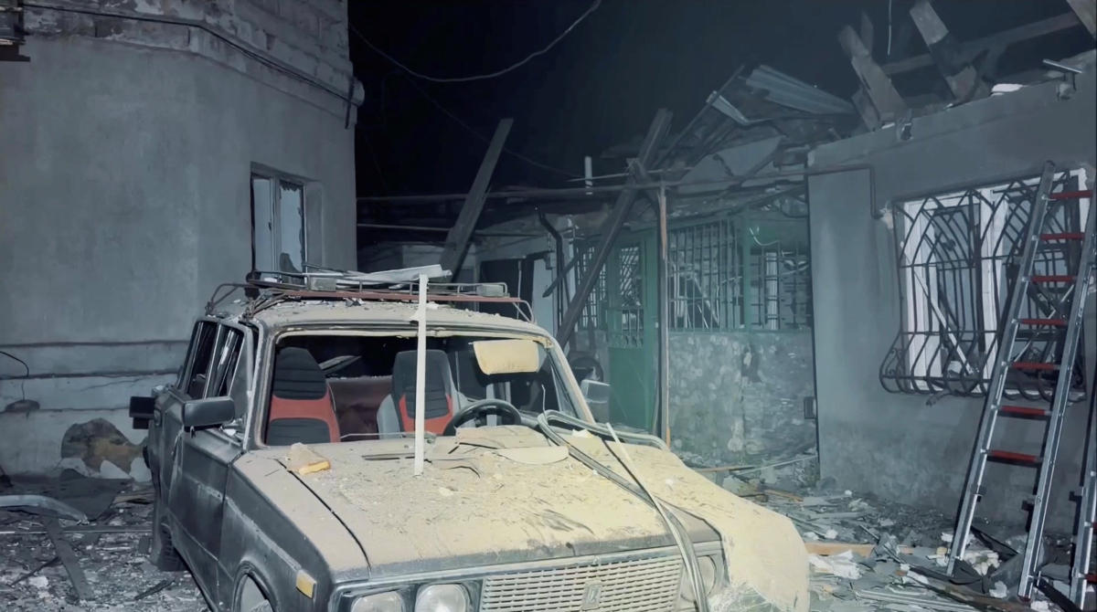 Above, a destroyed car and damaged buildings at the site of a Russian drone strike in Odesa, Ukraine, in this screengrab obtained from a handout video released on May 18, 2026. (Odesa City Council via Telegram/Reuters)