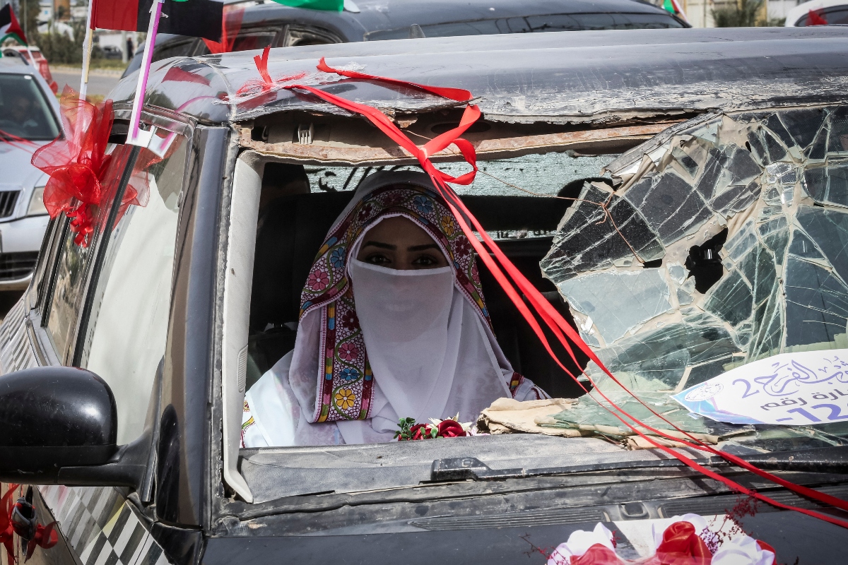 Families said they have been struggling to find new wedding dresses and many search instead for places that refurbish gowns and other kinds of clothes for their children. (AFP)
