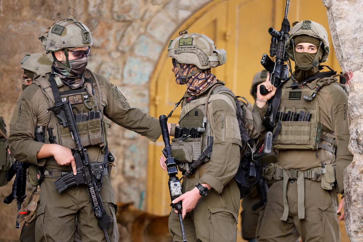 Israeli soldiers stand guard during a weekly settlers’ tour in Hebron, in the Israeli-occupied West Bank on May 16, 2026. (Reuters)