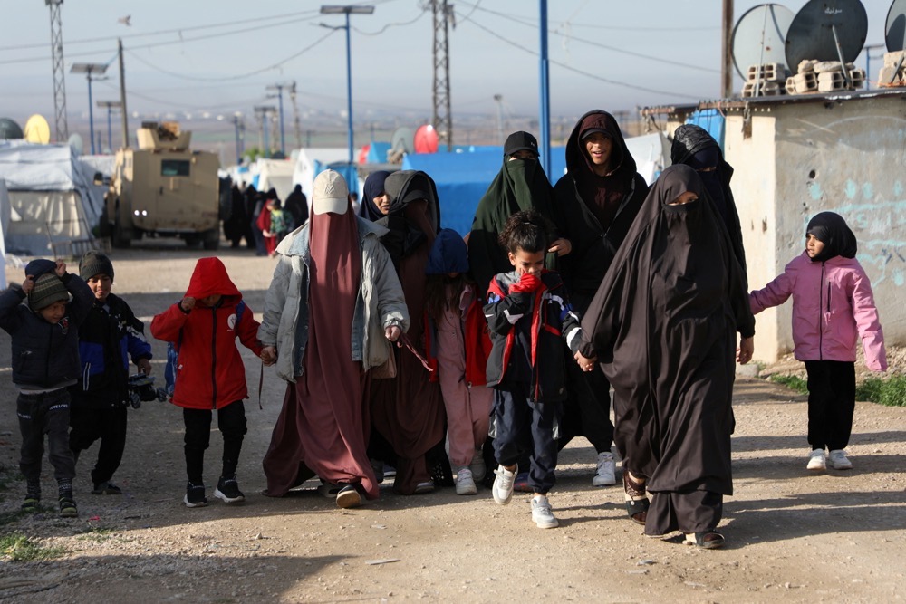 People walk in Al-Roj camp in Syria. (Reuters/File)