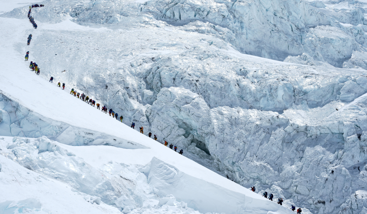 Climbers walk in a long queue as they head to summit Mount Everest in the Solukhumbu district, also known as the Everest region, Nepal, May 18, 2026. (REUTERS)