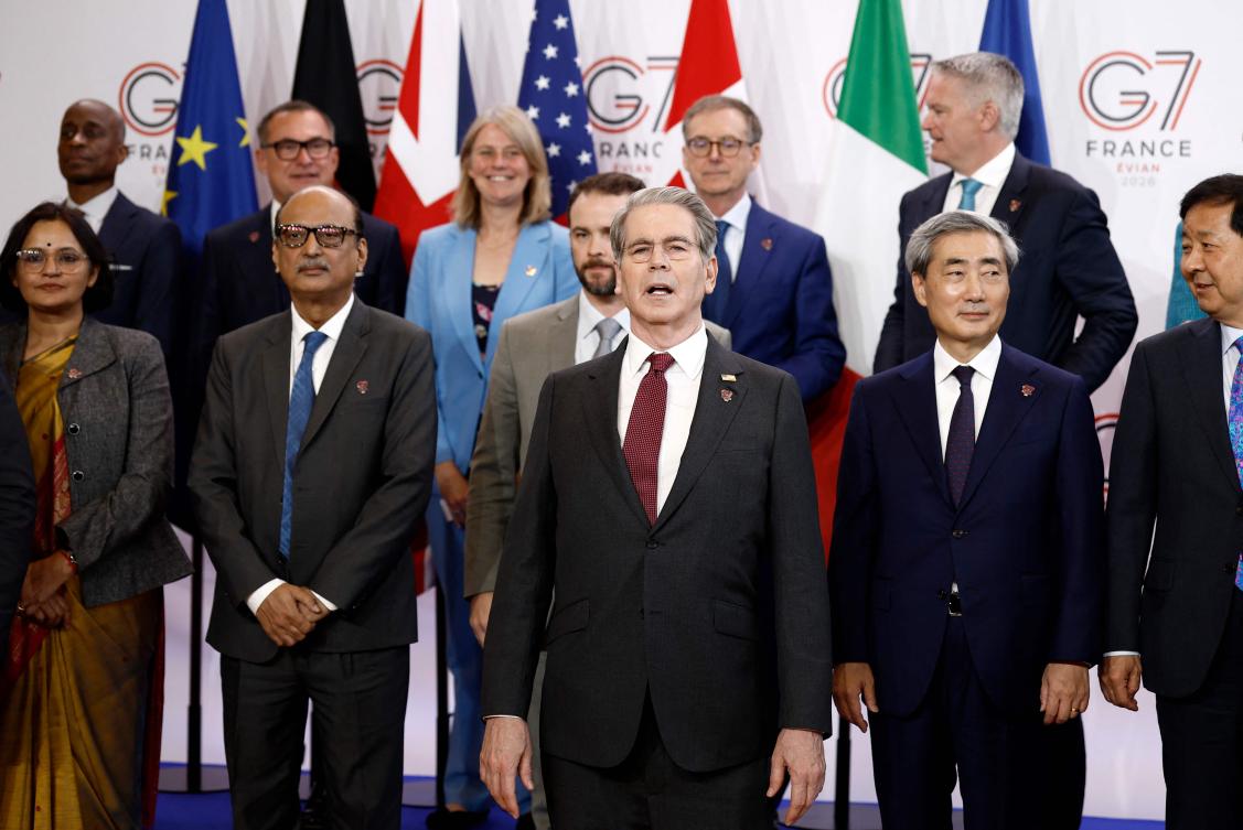 US Secretary of Treasury Scott Bessent (C) poses with others for a family photograph of G7 Finance Ministers and Central Bank Governors in Paris on Tuesday. (AFP)