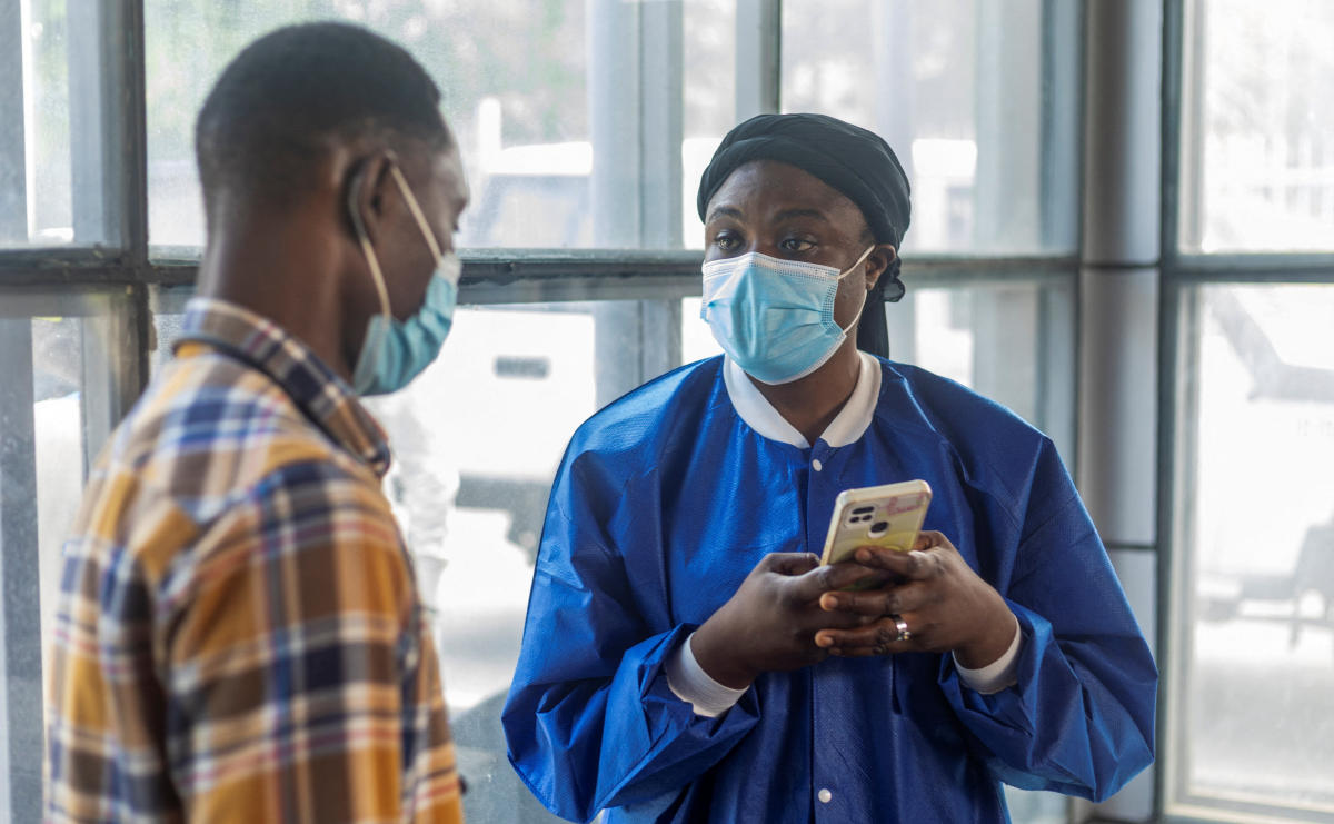 A man is screened on Tuesday as Rwanda tightens health screening at the Grande Barrier border following confirmation of an Ebola outbreak. (Reuters)