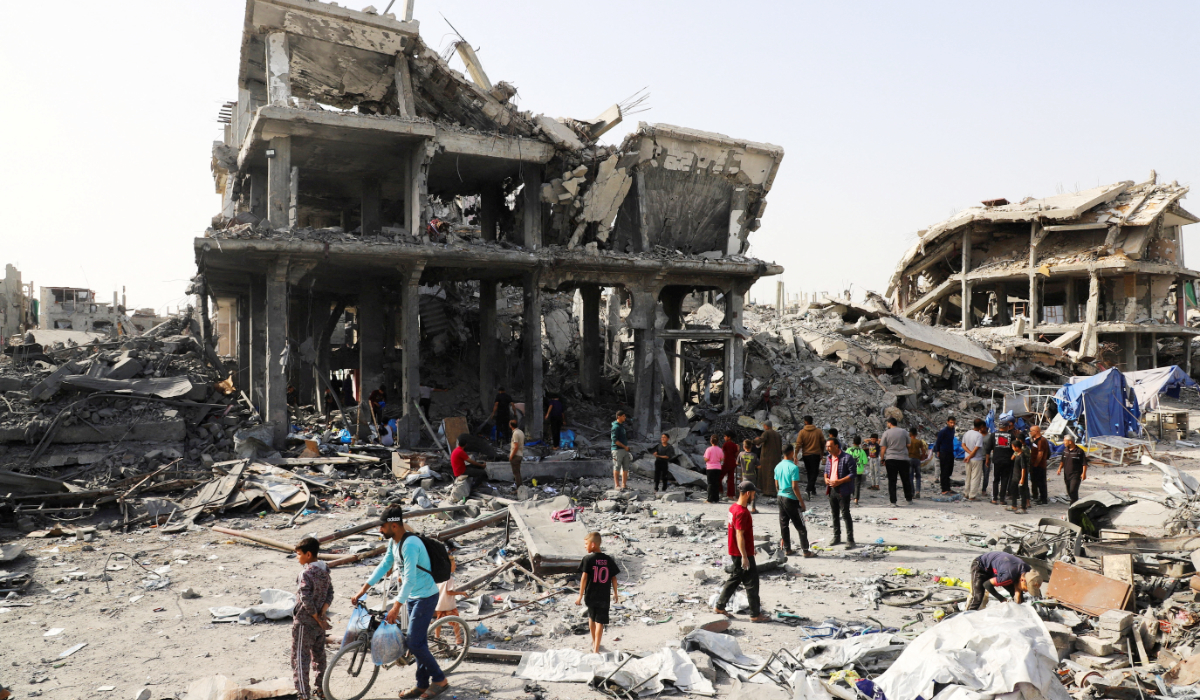 Palestinians inspect the site of an Israeli strike on a house that was pre-warned by the Israeli military to evacuate before the strike was carried out late on Monday, in Jabalia refugee camp in the northern Gaza Strip May 19, 2026. (REUTERS)