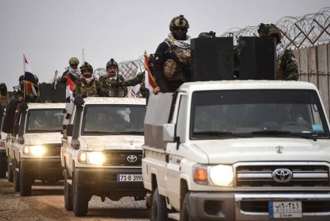 Analysis: Iraq struggles to balance rival powers in a tense Middle East