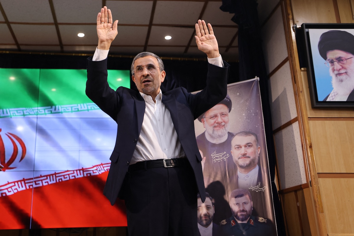 Former Iranian president Mahmoud Ahmadinejad waves to the crowd after registering his candidacy for Iran's upcoming presidential election in Tehran on June 2, 2024. (FILE/AFP)
