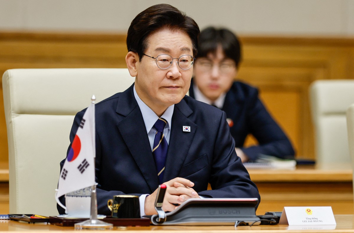 South Korea's President Lee Jae Myung sits during a meeting with Vietnam's Prime Minister Le Minh Hung at the Government Office in Hanoi, Vietnam. (AFP)