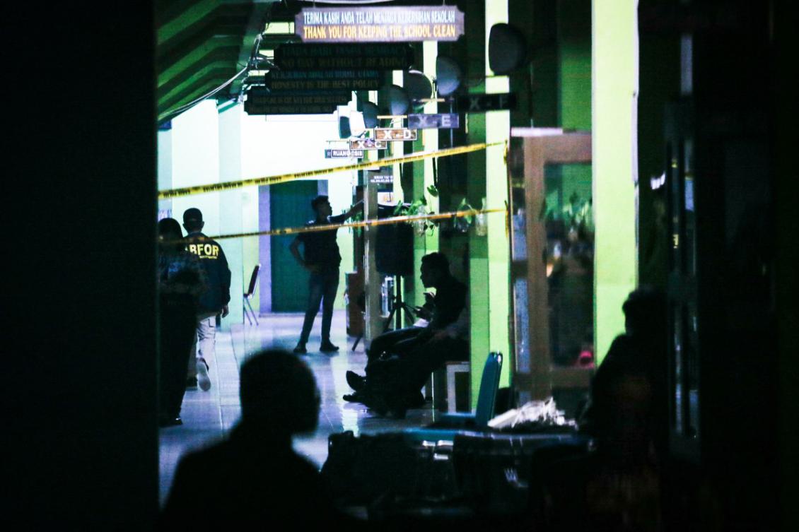 Police officials carry out an on-site investigation following a blast at a school in Jakarta on November 7, 2025. (AFP)
