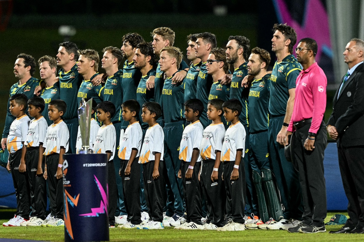 Australia's players stand for the national anthem before the start of the 2026 ICC Men's T20 Cricket World Cup group stage match between Oman and Australia at Pallekele International Cricket Stadium in Kandy on February 20, 2026. (FILE/AFP)