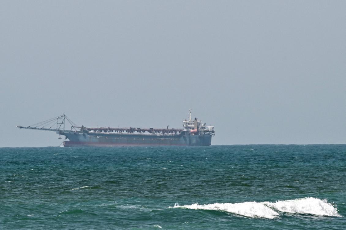 A vessel is anchored off the coast of Sharjah in the United Arab Emirates on May 21, 2026. (AFP)