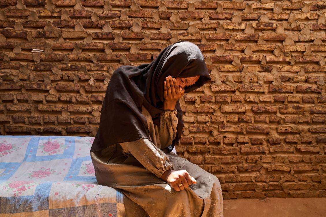 Azaher Abdallah, who has been searching for her husband, Fahani Al Fateh, for over a year, becomes emotional during an interview with The Associated Press in Omdurman, Sudan, Sunday, April 19, 2026. (AP Photo/Bernat Armangue)