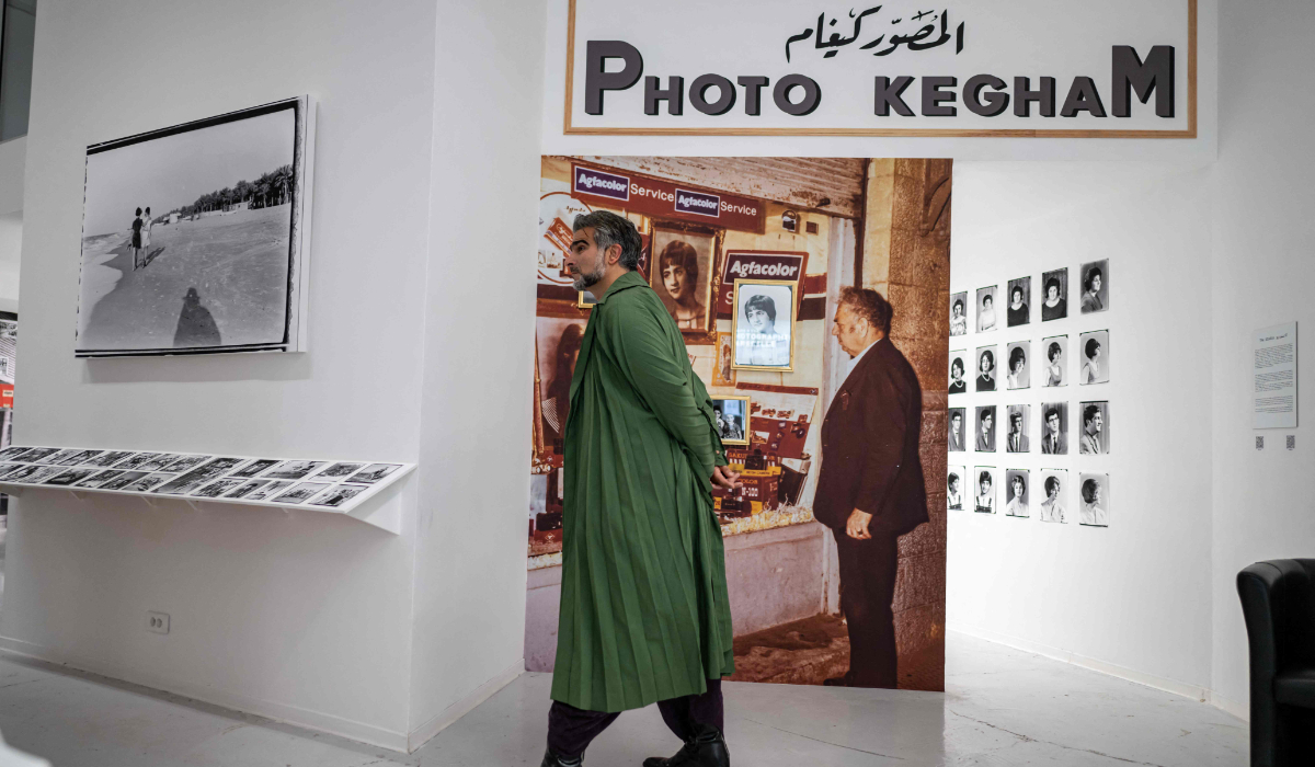 Palestinian-Armenian artist and artistic director Kegham Dhegalian Junior walks at the exhibition "Photo Kegham of Gaza : Unboxing" dedicated to the work of his grandfather, the late Armenian photographer Kegham Dhegalian Senior, at the Marseille Photo Centre on May 19, 2026. (AFP)